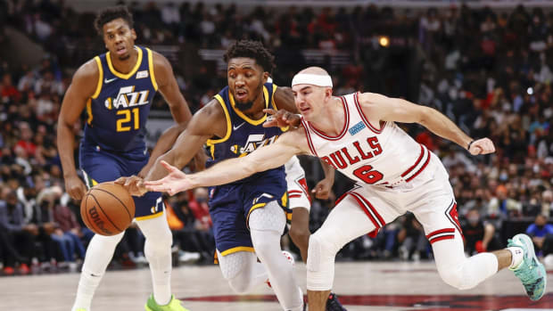 Oct 30, 2021; Chicago, Illinois, USA; Utah Jazz guard Donovan Mitchell (45) battles for the ball with Chicago Bulls guard Alex Caruso (6) during the first half at United Center. Mandatory Credit: Kamil Krzaczynski-USA TODAY Sports