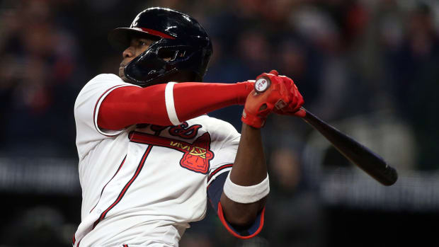 Atlanta Braves designated hitter Jorge Soler (12) hits a solo home run against the Houston Astros during the seventh inning of game four of the 2021 World Series at Truist Park.