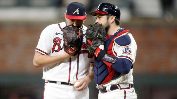 Oct 30, 2021; Atlanta, Georgia, USA; Atlanta Braves relief pitcher Dylan Lee (74) talks to catcher Travis d'Arnaud (16) prior to game four of the 2021 World Series against the Houston Astros at Truist Park.