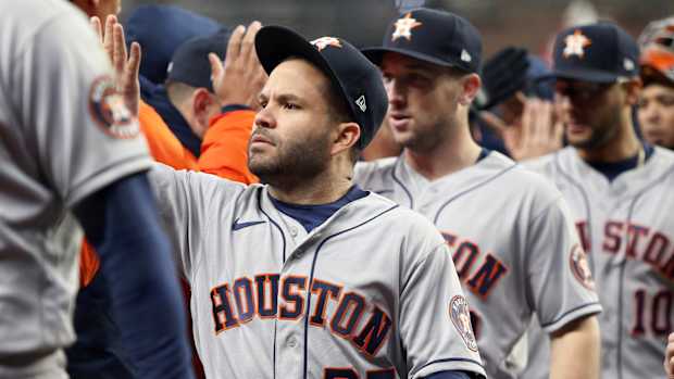 Oct 31, 2021; Atlanta, Georgia, USA; Houston Astros second baseman Jose Altuve (27) celebrates with teammates after defeating the Atlanta Braves in game five of the 2021 World Series at Truist Park.