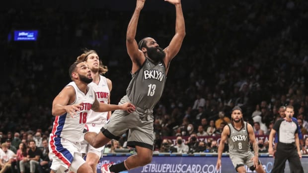 Oct 31, 2021; Brooklyn, New York, USA; Brooklyn Nets guard James Harden (13) loses the ball after driving between Detroit Pistons guard Cory Joseph (18) and forward Kelly Olynyk (13) in the third quarter at Barclays Center. Mandatory Credit: Wendell Cruz-USA TODAY Sports