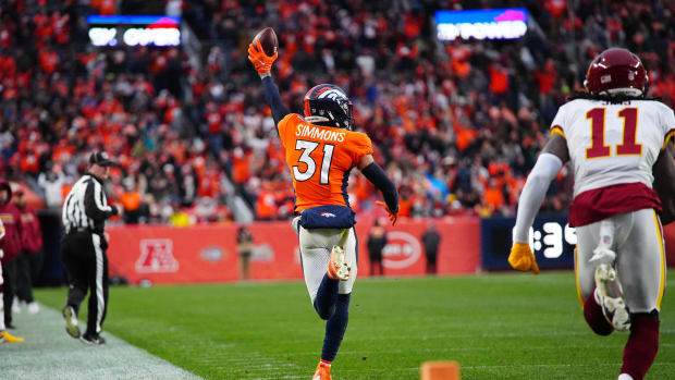 Denver Broncos free safety Justin Simmons (31) returns a interception in the fourth quarter against the Washington Football Team at Empower Field at Mile High.