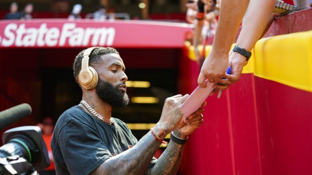 Sep 12, 2021; Kansas City, Missouri, USA; Cleveland Browns wide receiver Odell Beckham Jr. (13) signs autographs before the game against the Kansas City Chiefs at GEHA Field at Arrowhead Stadium. Mandatory Credit: Jay Biggerstaff-USA TODAY Sports