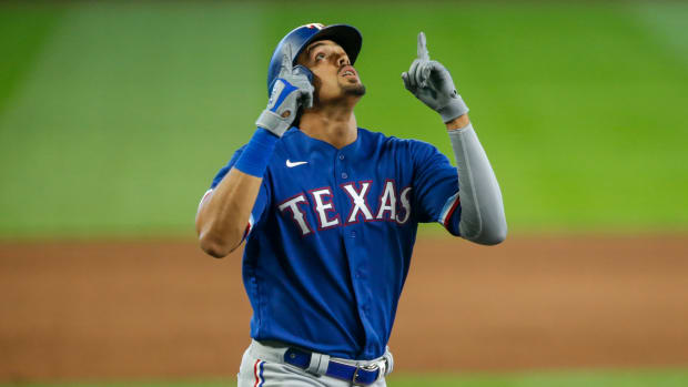 Sep 6, 2020; Seattle, Washington, USA; Texas Rangers first baseman Ronald Guzman (11) celebrates after hitting a solo-home run against the Seattle Mariners during the ninth inning at T-Mobile Park. Mandatory Credit: Joe Nicholson-USA TODAY Sports