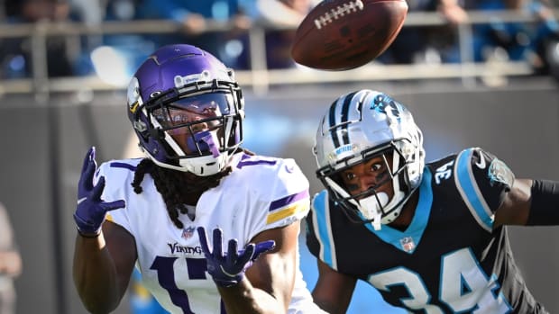 Oct 17, 2021; Charlotte, North Carolina, USA; Minnesota Vikings wide receiver K.J. Osborn (17) catches a touchdown pass to win the game in overtime as Carolina Panthers safety Sean Chandler (34) defends at Bank of America Stadium. Mandatory Credit: Bob Donnan-USA TODAY Sports