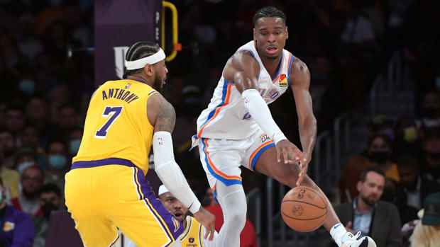 Nov 4, 2021; Los Angeles, California, USA; Los Angeles Lakers forward Carmelo Anthony (7) guards Oklahoma City Thunder guard Shai Gilgeous-Alexander (2) in the second half at Staples Center. Mandatory Credit: Jayne Kamin-Oncea-USA TODAY Sports