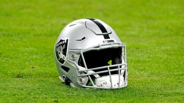 Dec 26, 2020; Paradise, Nevada, USA; A Las Vegas Raiders helmet rest on the football field before a game against the Miami Dolphins at Allegiant Stadium.