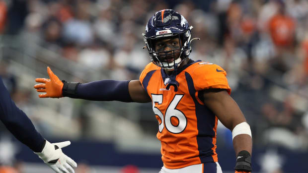 Denver Broncos linebacker Baron Browning (56) reacts after forcing a three and out in the third quarter against the Dallas Cowboys at AT&T Stadium.