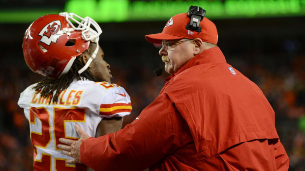 November 17, 2013; Denver, CO, USA; Kansas City Chiefs head coach Andy Reid (right) acknowledges running back Jamaal Charles (25) during the first quarter against the Denver Broncos at Sports Authority Field at Mile High. Mandatory Credit: Kyle Terada-USA TODAY Sports