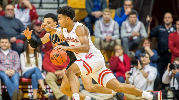 Nov 20, 2019; Bloomington, IN, USA; Indiana Hoosiers forward Justin Smith (3) dribbles the ball against Princeton Tigers guard Jaelin Llewellyn (0) in the second half at Simon Skjodt Assembly Hall. Mandatory Credit: Trevor Ruszkowski-USA TODAY Sports