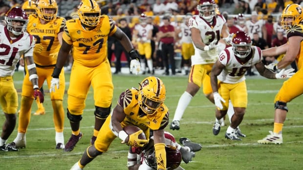 Nov 6, 2021; Tempe, Arizona, USA; Arizona State Sun Devils running back Rachaad White (3) dives for a touchdown over USC Trojans safety Xavion Alford (29) in the second half at Sun Devil Stadium. Mandatory Credit: Rob Schumacher-USA TODAY Sports