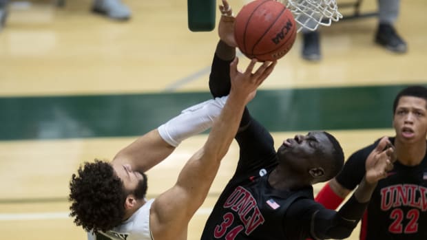 Jan 7, 2021; Fort Collins, CO, USA; Colorado State Rams guard David Roddy (21) tries to shoot the ball as UNLV Rebels forward Cheikh Mbacke Diong (34) defends in the second half of the game at Moby Arena at Colorado State University in Fort Collins, Colo. on Thursday, Jan. 7, 2021. Mandatory Credit: Bethany Baker/The Coloradoan via USA TODAY NETWORK