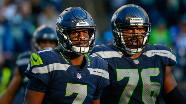 Oct 31, 2021; Seattle, Washington, USA; Seattle Seahawks quarterback Geno Smith (7) and offensive tackle Duane Brown (76) walk to the sideline following a series against the Jacksonville Jaguars during the fourth quarter at Lumen Field. Mandatory Credit: Joe Nicholson-USA TODAY Sports