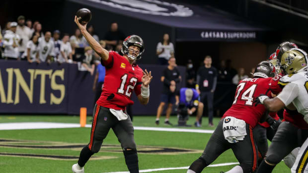 Oct 31, 2021; New Orleans, Louisiana, USA; Tampa Bay Buccaneers quarterback Tom Brady (12) passes the ball against New Orleans Saints during the second half at Caesars Superdome. Mandatory Credit: Stephen Lew-USA TODAY Sports