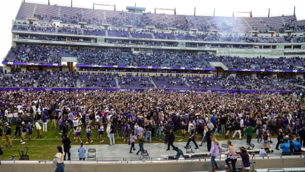 Nov 6, 2021; Fort Worth, Texas, USA; TCU Horned Frogs fans rush the field after the game against the Baylor Bears at Amon G. Carter Stadium.