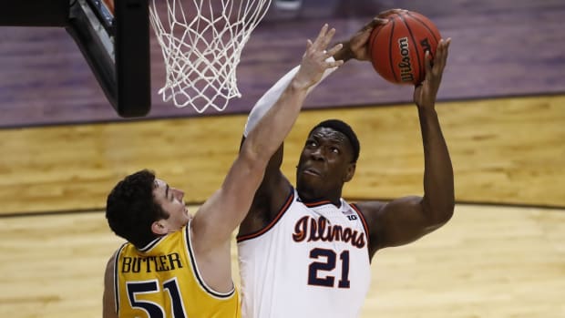 Mar 19, 2021; Indianapolis, Indiana, USA; Illinois Fighting Illini center Kofi Cockburn (21) shoots against Drexel Dragons forward James Butler (51) during the first round of the 2021 NCAA Tournament at Indiana Farmers Coliseum. Mandatory Credit: Aaron Doster-USA TODAY Sports