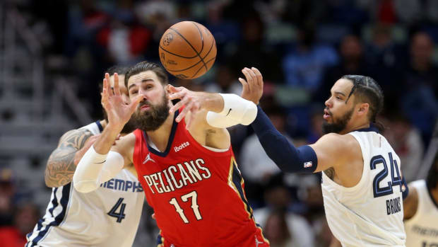 Nov 13, 2021; New Orleans, Louisiana, USA; New Orleans Pelicans center Jonas Valanciunas (17) is defended by Memphis Grizzlies center Steven Adams (4) and forward Dillon Brooks (24) in the second half at the Smoothie King Center. Mandatory Credit: Chuck Cook-USA TODAY Sports