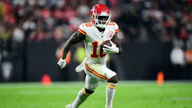 Nov 14, 2021; Paradise, Nevada, USA; Kansas City Chiefs wide receiver Tyreek Hill (10) runs the ball against the Las Vegas Raiders during the first half at Allegiant Stadium. Mandatory Credit: Gary A. Vasquez-USA TODAY Sports
