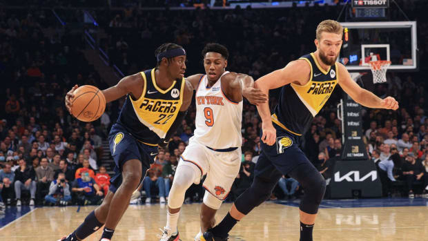 Nov 15, 2021; New York, New York, USA; Indiana Pacers guard Caris LeVert (22) drives to the basket as New York Knicks guard RJ Barrett (9) defends in front of forward Domantas Sabonis (11) during the first half at Madison Square Garden. Mandatory Credit: Vincent Carchietta-USA TODAY Sports