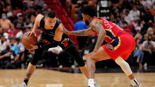 Nov 17, 2021; Miami, Florida, USA; Miami Heat guard Tyler Herro (14) controls the ball around New Orleans Pelicans guard Nickeil Alexander-Walker (6) during the second half at FTX Arena. Mandatory Credit: Jasen Vinlove-USA TODAY Sports