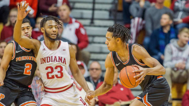 Nov 20, 2019; Bloomington, IN, USA; Princeton Tigers forward Tosan Evbuomwan (20) dribbles the ball against Indiana Hoosiers forward Damezi Anderson (23) in the first half at Simon Skjodt Assembly Hall. Mandatory Credit: Trevor Ruszkowski-USA TODAY Sports