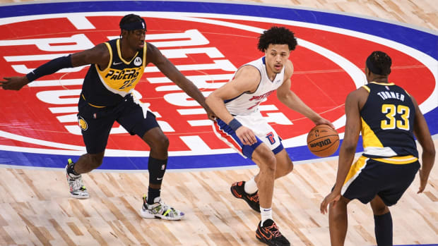 Nov 17, 2021; Detroit, Michigan, USA; Detroit Pistons guard Cade Cunningham (2) drives to the basket as Indiana Pacers center Myles Turner (33) and guard Caris LeVert (22) defend during the third quarter at Little Caesars Arena. Mandatory Credit: Tim Fuller-USA TODAY Sports