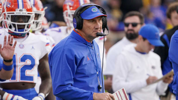 Nov 20, 2021; Columbia, Missouri, USA; Florida Gators head coach Dan Mullen watches play against the Missouri Tigers during the first half at Faurot Field at Memorial Stadium.