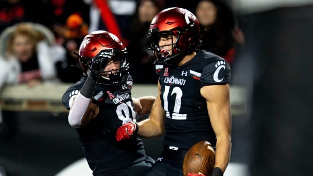 Cincinnati Bearcats wide receiver Alec Pierce (12) celebrates with Cincinnati Bearcats tight end Josh Whyle (81) after scoring a touchdown in the second half of the NCAA football game on Saturday, Nov...