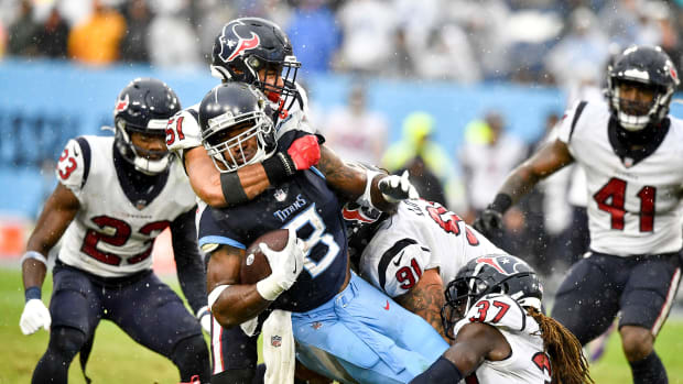 Tennessee Titans running back Adrian Peterson (8) gets stopped by the Texans defense during the third quarter at Nissan Stadium Sunday, Nov. 21, 2021 in Nashville, Tenn. Titans Texans 337