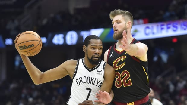 Nov 22, 2021; Cleveland, Ohio, USA; Cleveland Cavaliers forward Dean Wade (32) defends Brooklyn Nets forward Kevin Durant (7) in the second quarter at Rocket Mortgage FieldHouse. Mandatory Credit: David Richard-USA TODAY Sports