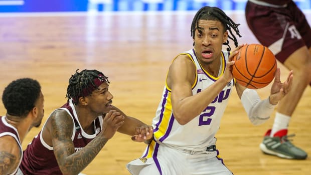 Dec 29, 2020; Baton Rouge, Louisiana, USA; LSU Tigers forward Trendon Watford (2) dribbles against Texas A&amp;M Aggies guard Quenton Jackson (3) during the first half at the Pete Maravich Assembly Center. Mandatory Credit: Stephen Lew-USA TODAY Sports