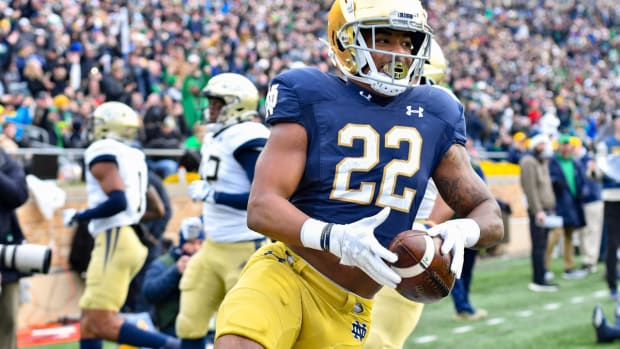 Nov 20, 2021; South Bend, Indiana, USA; Notre Dame Fighting Irish running back Logan Diggs (22) scores a touchdown in the second quarter against the Georgia Tech Yellow Jackets at Notre Dame Stadium. Mandatory Credit: Matt Cashore-USA TODAY Sports