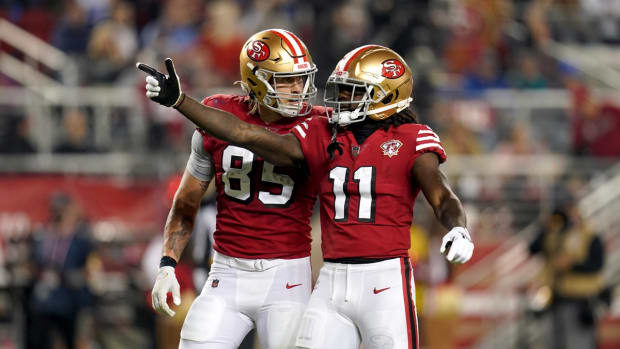 Nov 15, 2021; Santa Clara, California, USA; San Francisco 49ers wide receiver Brandon Aiyuk (11) celebrates next to tight end George Kittle (85) after making a catch for a first down against the Los Angeles Rams in the second quarter at Levi's Stadium. Mandatory Credit: Cary Edmondson-USA TODAY Sports