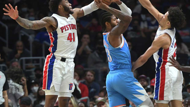 Nov 26, 2021; Los Angeles, California, USA; Detroit Pistons forward Saddiq Bey (41) and guard Cade Cunningham (2) defend Los Angeles Clippers guard Paul George (13) in the second half at Staples Center. Mandatory Credit: Jayne Kamin-Oncea-USA TODAY Sports