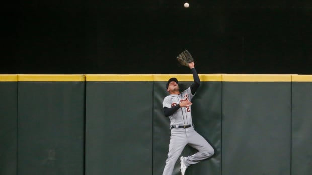 May 19, 2021; Seattle, Washington, USA; Detroit Tigers center fielder JaCoby Jones (21) jumps against the wall to catch a potential home run against the Seattle Mariners during the seventh inning at T-Mobile Park. Mandatory Credit: Joe Nicholson-USA TODAY Sports
