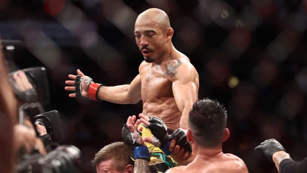 Aug 7, 2021; Houston, Texas, USA; Jose Aldo (red gloves) reacts to fight against Pedro Munhoz (blue gloves) during UFC 265 at Toyota Center. Mandatory Credit: Troy Taormina-USA TODAY Sports