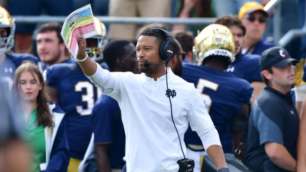 Oct 2, 2021; South Bend, Indiana, USA; Notre Dame Fighting Irish Defensive Coordinator Marcus Freeman signals to his players in the second quarter against the Cincinnati Bearcats at Notre Dame Stadium.