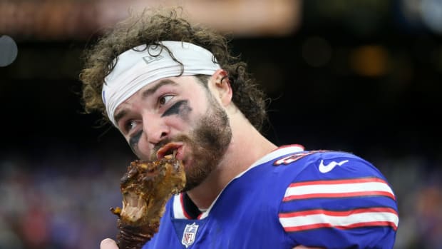 Nov 25, 2021; New Orleans, Louisiana, USA; Buffalo Bills tight end Dawson Knox (88) bites into a turkey leg at the end of their game against the New Orleans Saints at the Caesars Superdome. Mandatory Credit: Chuck Cook-USA TODAY Sports