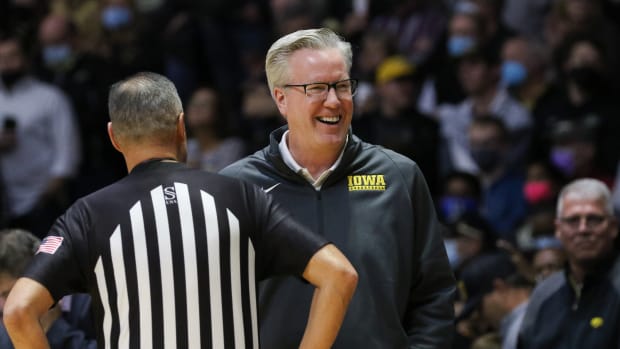 Iowa coach Fran McCaffery jokes with an official before a game against Purdue on Dec. 3, 2021 at Mackey Arena in West Lafayette, Ind. (Rob Howe/HawkeyeNation.com)