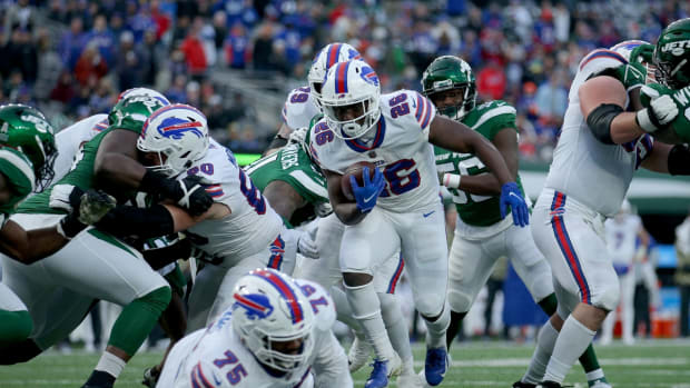 Nov 14, 2021; East Rutherford, New Jersey, USA; Buffalo Bills running back Devin Singletary (26) runs for a touchdown against the New York Jets during the fourth quarter at MetLife Stadium. Mandatory Credit: Brad Penner-USA TODAY Sports