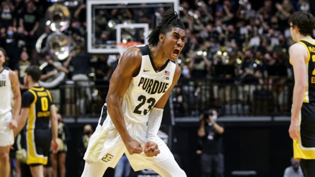 Purdue guard Jaden Ivey reacts after dunking vs Iowa
