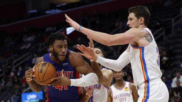 Dec 6, 2021; Detroit, Michigan, USA; Detroit Pistons forward Saddiq Bey (41) is defended by Oklahoma City Thunder center Mike Muscala (33) in the second half at Little Caesars Arena. Mandatory Credit: Rick Osentoski-USA TODAY Sports
