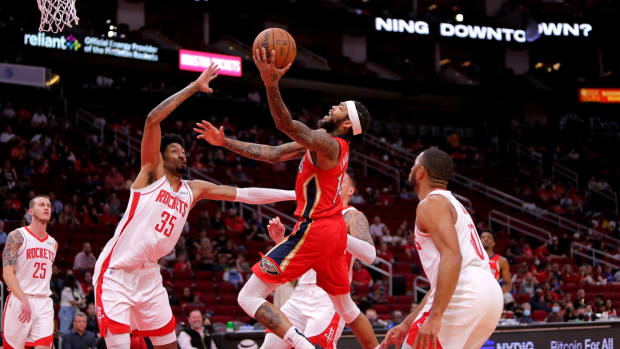 Dec 5, 2021; Houston, Texas, USA; New Orleans Pelicans forward Brandon Ingram (14) shoots the ball as Houston Rockets center Christian Wood (35) defends during the first quarter at Toyota Center. Mandatory Credit: Erik Williams-USA TODAY Sports