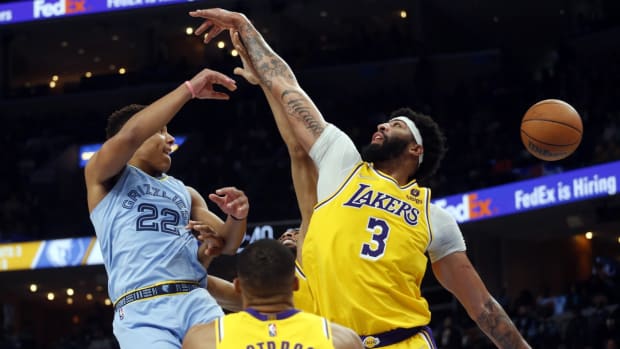 Dec 9, 2021; Memphis, Tennessee, USA; Memphis Grizzles guard Desmond Bane (22) passes the ball as Los Angeles Lakers forward Anthony Davis (3) defends during the second half at FedExForum. Mandatory Credit: Petre Thomas-USA TODAY Sports