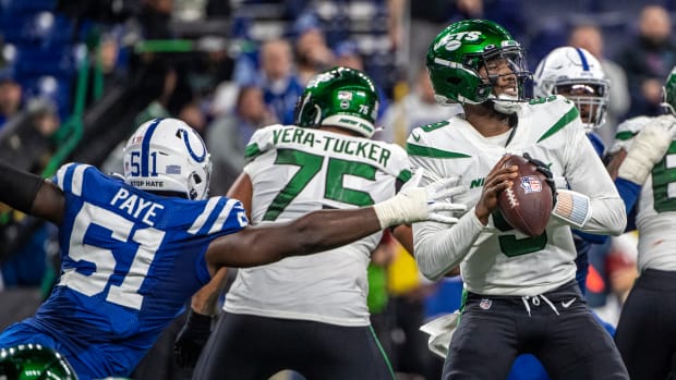 Nov 4, 2021; Indianapolis, Indiana, USA; New York Jets quarterback Josh Johnson (9) is pressured by Indianapolis Colts defensive end Kwity Paye (51) during the second half at Lucas Oil Stadium.