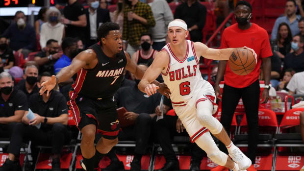 Dec 11, 2021; Miami, Florida, USA; Chicago Bulls guard Alex Caruso (6) drives the ball around Miami Heat guard Kyle Lowry (7) during the first half at FTX Arena. Mandatory Credit: Jasen Vinlove-USA TODAY Sports