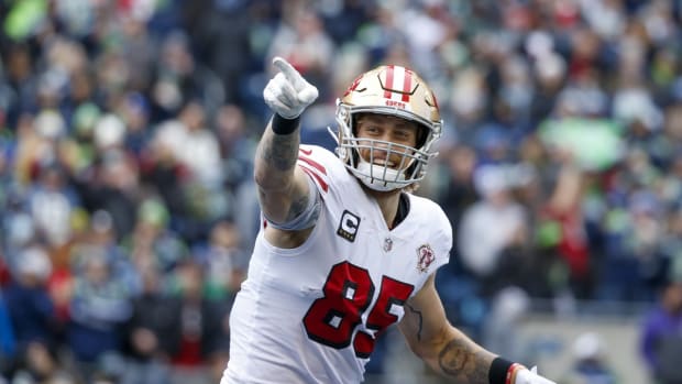 Dec 5, 2021; Seattle, Washington, USA; San Francisco 49ers tight end George Kittle (85) celebrates after catching a touchdown pass against the Seattle Seahawks during the first quarter at Lumen Field. Mandatory Credit: Joe Nicholson-USA TODAY Sports