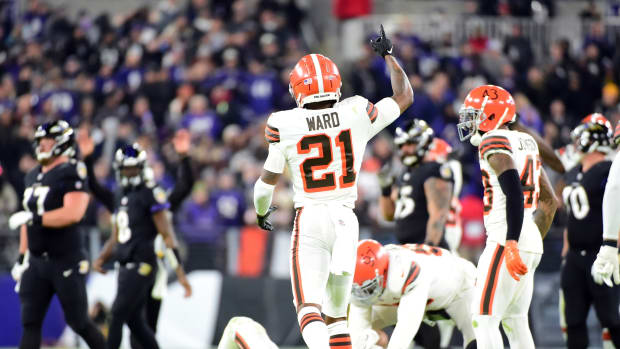 Nov 28, 2021; Baltimore, Maryland, USA; Cleveland Browns cornerback Denzel Ward (21) reacts after an interception in the second quarter against the Baltimore Ravens at M&T Bank Stadium. Mandatory Credit: Evan Habeeb-USA TODAY Sport