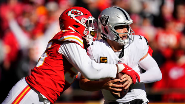 Derek Carr is sacked by a Chiefs defender