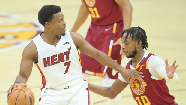 Dec 13, 2021; Cleveland, Ohio, USA; Cleveland Cavaliers guard Darius Garland (10) defends Miami Heat guard Kyle Lowry (7) in the first quarter at Rocket Mortgage FieldHouse. Mandatory Credit: David Richard-USA TODAY Sports